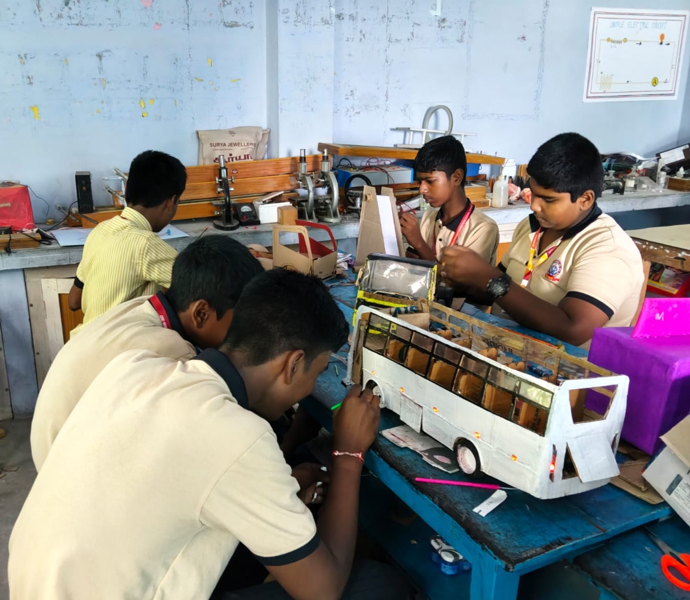 Students building an engineering model together